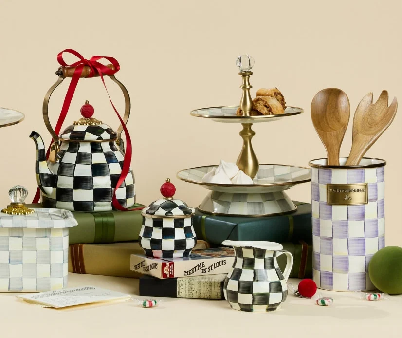 MacKenzie-Childs Courtly Check tea kettle tied with a red ribbon, with a Courtly Check sugar bowl, creamer and a two-tier sweet stand