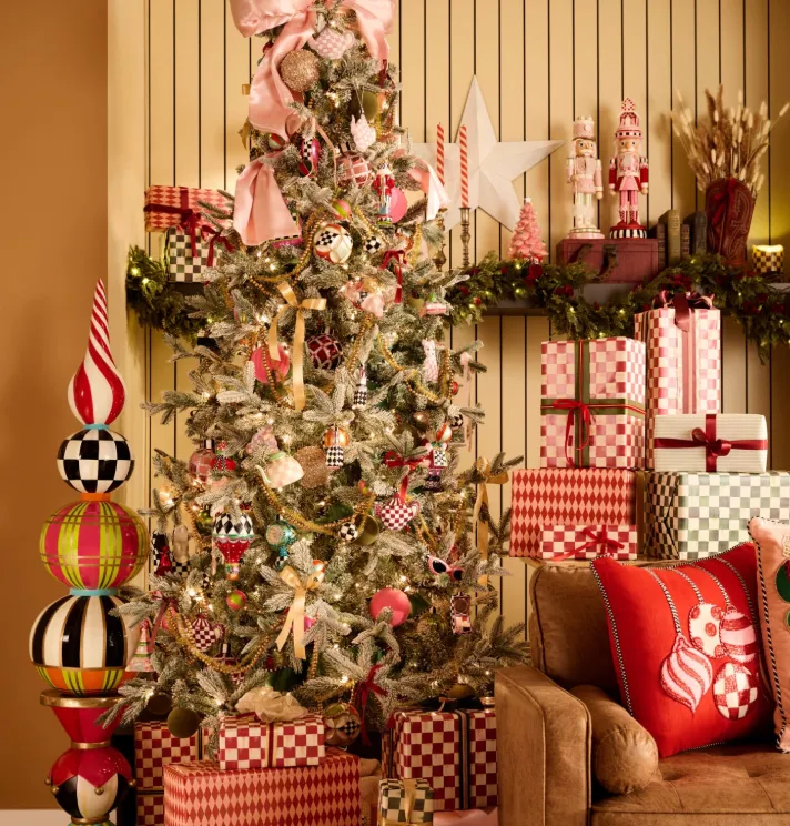 Christmas tree with MacKenzie-Childs finials and wrapped gifts