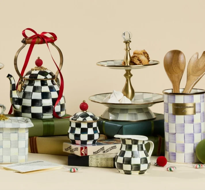 MacKenzie-Childs Courtly Check tea kettle tied with a red ribbon, with a Courtly Check sugar bowl, creamer and a two-tier sweet stand