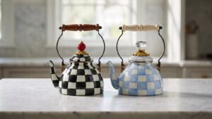 MacKenzie-Childs Courtly Check 1 Quart Tea Kettle and Sky Check 1 Quart Tea Kettle side by side on a marble kitchen counter